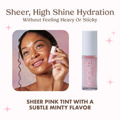 Kopari Tri-Peptide Lip Cloud on lips with moisturized, soft appearance.