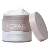 Kopari Ultra Restore Body Butter jar close-up showing rich moisture.