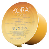 KORA Organics Turmeric Glow Moisturizer Refill Pod bottle on vanity for daily hydration