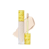 Kosas Revealer Concealer under-eye brightening application for refreshed eyes.