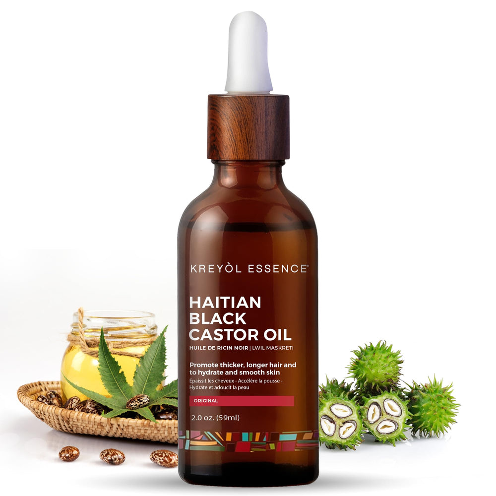 Kreyol Essence 2oz Haitian Black Castor Oil bottle—promotes thicker hair and natural shine.