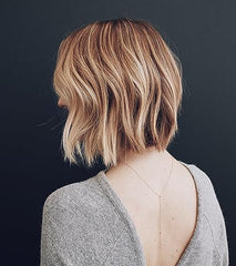 Kristin Ess Hair Refine Signature Finishing Hairspray creates brushable texture without stiffness or crunch