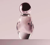 Kylie Cosmetics Cosmic EDP bottle front; ambery floral scent for daily glamour.