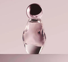 Kylie Cosmetics Cosmic EDP bottle front; ambery floral scent for daily glamour.