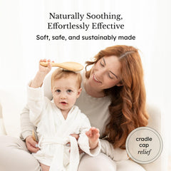 Kyte Baby goat hair brush close-up showing soft bristles ideal for cradle cap care.