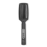 L'ANGE HAIR Le Vite Curve brush closeup showing curved bristles for faster straightening and frizz control.