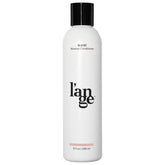 L'ANGE HAIR Slické Blowout Conditioner bottle shows weightless hydration for voluminous shine.
