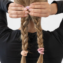 L. Erickson thick-hair no-crease hold for long, slip-free ponytails.