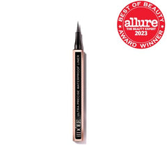 Lancome Idole Liner waterproof swatch shows lasting glossy black color.