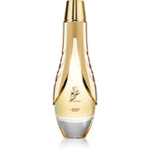 Lattafa Pride Gharam bottle-pour close-up, long-lasting scent for evening wear.