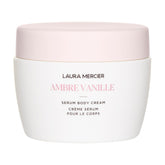 Laura Mercier Serum Body Cream bottle close-up showing Ambre Vanille fragrance for daily nourishment.