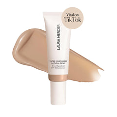 Laura Mercier tinted moisturizer swatch in fawn shade for buildable sheer to light coverage.