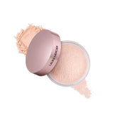 Laura Mercier translucent loose powder jar close-up for a soft matte, long-wear finish.