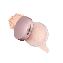 Laura Mercier translucent loose powder jar close-up for a soft matte, long-wear finish.