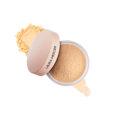 Laura Mercier Ultra-Blur loose powder compact delivers a soft-focus finish that lasts.