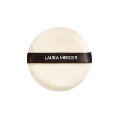 Laura Mercier Velour Puff closeup shows textured surface for precise powder pickup.