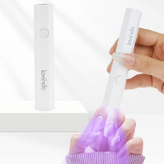 Lavinda handheld UV light closeup showing compact design for quick gel cures.