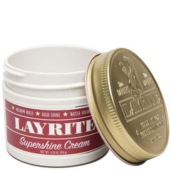 Layrite Supershine Cream jar being squeezed shows easy application for sleek styles.