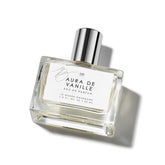 Le Monde Gourmand Aura de Vanille bottle closeup showing warm amber tones for evenings.