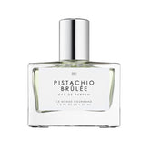 Le Monde Gourmand Pistachio Brûlée bottle glowing for elegant evening wear