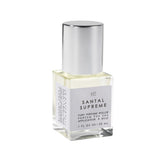 Le Monde Gourmand Santal Supreme bottle closeup highlights refined woody notes.
