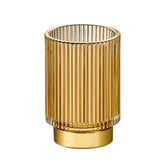 LEICURACE vintage glass brush cup with gold base enhances vanity organization.