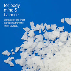 Close-up of LIFE-FLO magnesium bath flakes ingredients featuring magnesium chloride and minerals.