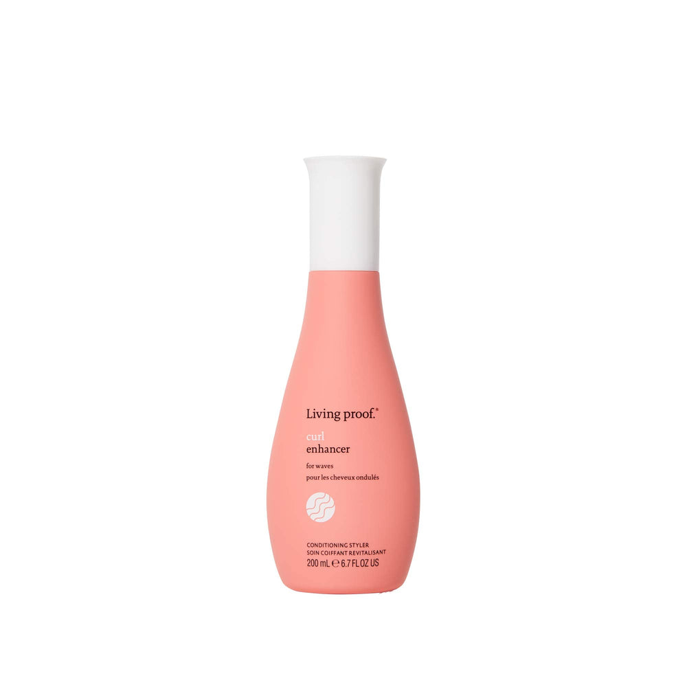 Living Proof Curl Enhancer bottle closeup for defined waves and frizz protection.