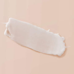 Living Proof Curl Enhancer swatch displays creamy texture for gentle hold.