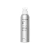 Living Proof Dry Shampoo Advanced Clean bottle demonstrates oil absorption for a just-washed feel
