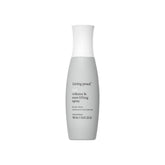 Living proof Full Volume Root-Lifting Spray bottle closeup highlighting root lift potential.
