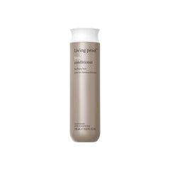 Living Proof No Frizz Conditioner bottle pouring to highlight frizz control benefits