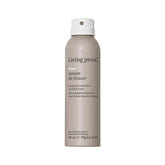 Living Proof No Frizz Instant De-Frizzer bottle with pump delivering lightweight frizz control on dry hair.