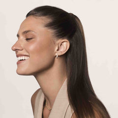 Living Proof No Frizz Smooth Styling Cream hands applying the cream for frizz control