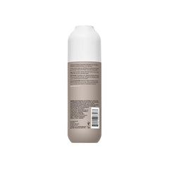 Living Proof No Frizz Smooth Styling Spray nozzle closeup highlights precise application without buildup.