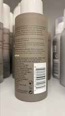 Living Proof No Frizz Vanishing Oil pump shows quick-absorb formula for silkier hair.
