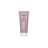 Living Proof Restore Repair Mask bottle shows creamy conditioner for breakage reduction.