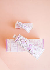 LOLLIA Relax Handcreme bottle closeup reveals creamy texture for quick absorption.