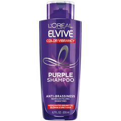 L'Oreal Paris Elvive Color Vibrancy Purple Shampoo bottle neutralizes brassiness for cooler tones.