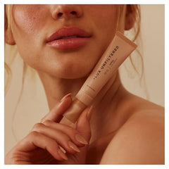Lux Unfiltered N°15 bottle close-up showing fragrance-free, hydrating lip care.