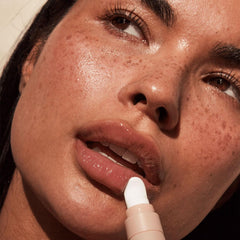 Lux Unfiltered N°15 cooling applicator in action for refreshing lip hydration.