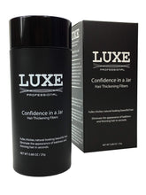 LUXE Hair Building Fibers jar closeup showing natural coverage for thinning areas.