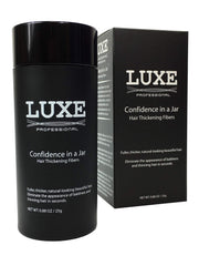 LUXE Hair Building Fibers jar closeup showing natural coverage for thinning areas.