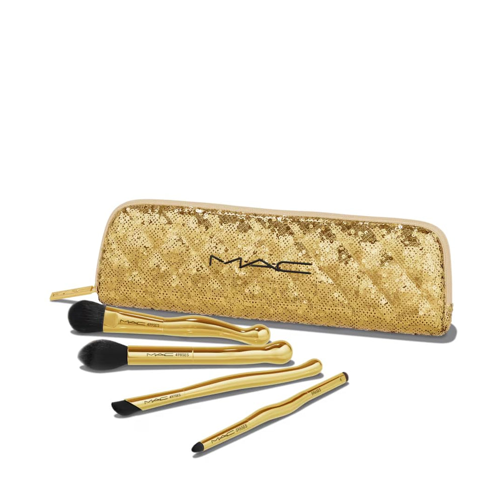 MAC Golden Touch Mini Brush Kit in sequined bag for travel-ready makeup basics.