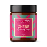 Madani Naturals Chebe Hair Grease bottle close-up shows premium formula for healthy hair.