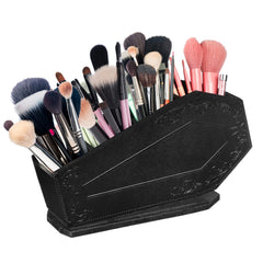 Maitys coffin makeup brush holder with embossed crucifix, neatly organizing brushes.