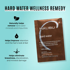 Malibu C Hard Water Remedy crystals dissolve in hands for deep cleansing.