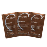 Malibu C Hard Water Wellness Remedy packets close-up showing mineral cleansing benefits