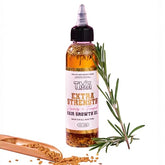 The Mane Attraction extra-strength rosemary-fenugreek oil bottle label highlights natural ingredients for scalp care.
