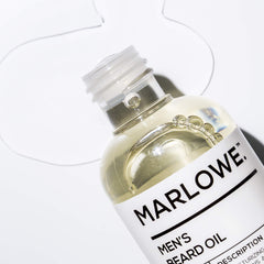 MARLOWE No. 143 Beard Oil close-up label highlights natural conditioning ingredients.